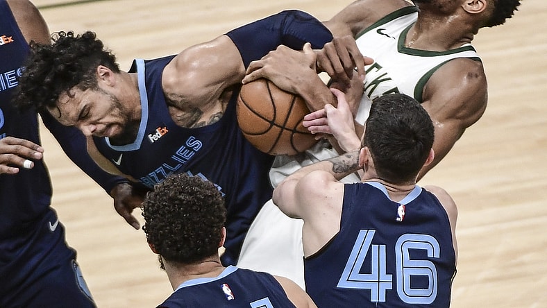 Apr 17, 2021; Milwaukee, Wisconsin, USA; Milwaukee Bucks forward Giannis Antetokounmpo (34) and Memphis Grizzlies forward Dillon Brooks (24) battle for a rebound in the second quarter at Fiserv Forum. Mandatory Credit: Benny Sieu-USA TODAY Sports