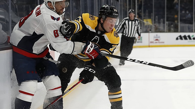 Apr 18, 2021; Boston, Massachusetts, USA; Boston Bruins defenseman Charlie McAvoy (73) collides with Washington Capitals left wing Alex Ovechkin (8) during the first period at TD Garden. Mandatory Credit: Winslow Townson-USA TODAY Sports