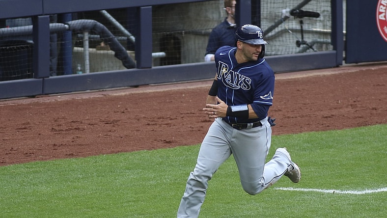 Apr 18, 2021; Bronx, New York, USA; Tampa Bay Rays catcher Mike Zunino (10) heads home to score the tying run against the New York Yankees in the third inning at Yankee Stadium. Mandatory Credit: Wendell Cruz-USA TODAY Sports