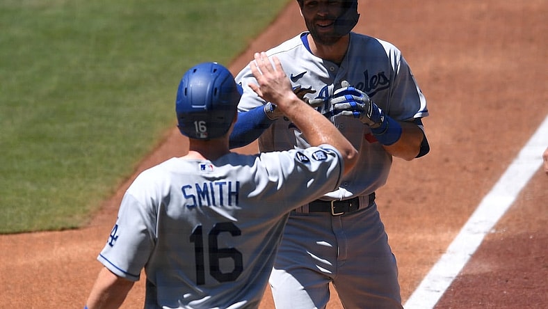 Apr 18, 2021; San Diego, California, USA; Los Angeles Dodgers center fielder fielder Chris Taylor (R) is congratulated by catcher Will Smith (16) after hitting a two-run home run during the second inning against the San Diego Padres at Petco Park. Mandatory Credit: Orlando Ramirez-USA TODAY Sports