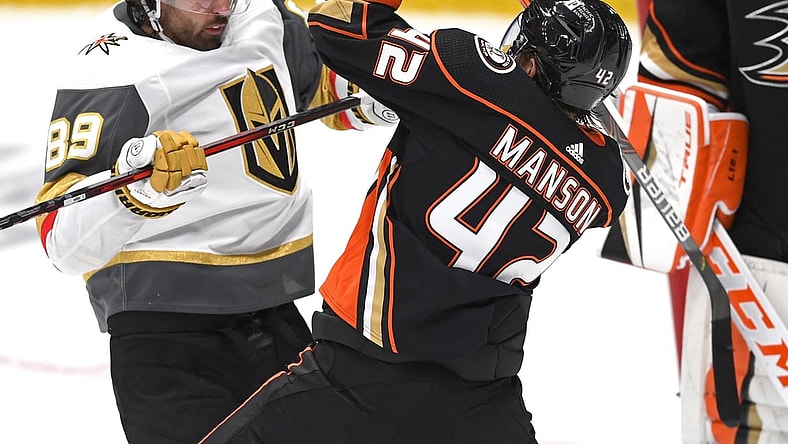 Apr 18, 2021; Anaheim, California, USA; Vegas Golden Knights right wing Alex Tuch (89) and Anaheim Ducks defenseman Josh Manson (42) battle in front of the net in the second period at Honda Center. Mandatory Credit: Jayne Kamin-Oncea-USA TODAY Sports