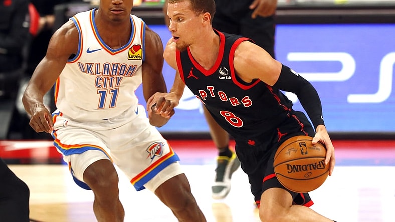 Apr 18, 2021; Tampa, Florida, USA; Toronto Raptors guard Malachi Flynn (8) drives to the basket as Oklahoma City Thunder guard Theo Maledon (11) defends during the first half at Amalie Arena. Mandatory Credit: Kim Klement-USA TODAY Sports