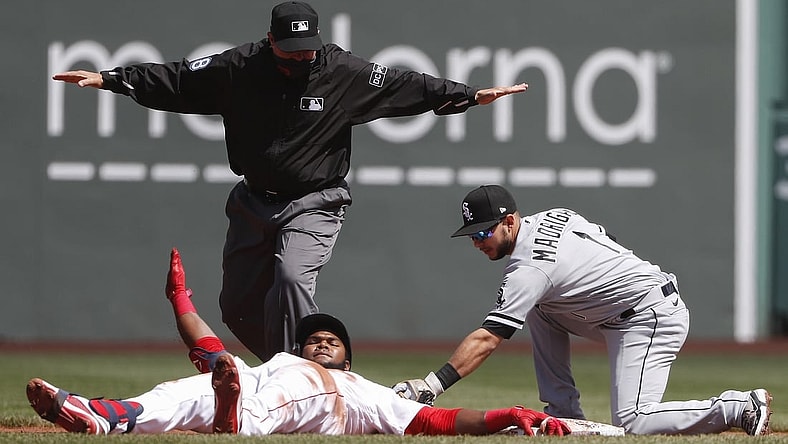 Apr 19, 2021; Boston, Massachusetts, USA; Chicago White Sox second baseman Nick Madrigal (1) applies a late tag as Boston Red Sox center fielder Franchy Cordero (16) slides safely into second after advancing on an error after a single as umpire Doug Eddings (88) makes the call during the first inning at Fenway Park. Mandatory Credit: Winslow Townson-USA TODAY Sports