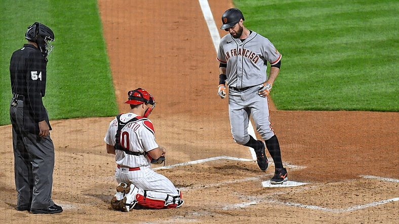 Apr 19, 2021; Philadelphia, Pennsylvania, USA; San Francisco Giants first baseman Brandon Belt (9) steps on home plate after hitting a 2-run home run during the third inning against the Philadelphia Phillies at Citizens Bank Park. Mandatory Credit: Eric Hartline-USA TODAY Sports