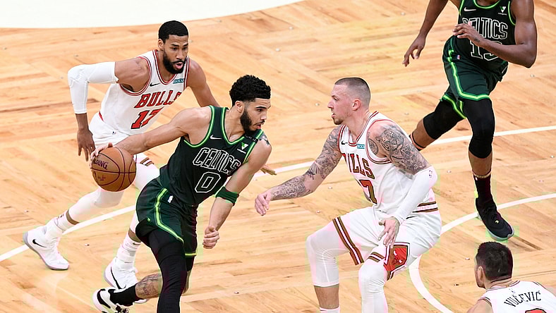 Apr 19, 2021; Boston, Massachusetts, USA; Boston Celtics forward Jayson Tatum (0) drives to the basket Chicago Bulls center Daniel Theis (27) during the first half at the TD Garden. Mandatory Credit: Brian Fluharty-USA TODAY Sports
