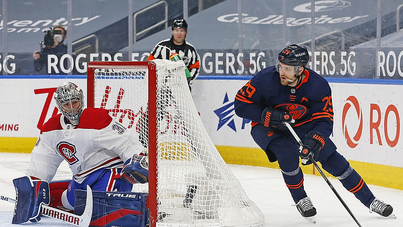 Apr 19, 2021; Edmonton, Alberta, CAN; Edmonton Oilers forward Leon Draisaitl (29) moves the puck behind Montreal Canadiens goaltender Carey Price (31) during the first period at Rogers Place. Mandatory Credit: Perry Nelson-USA TODAY Sports