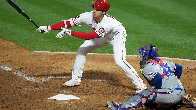 Apr 19, 2021; Anaheim, California, USA; Los Angeles Angels designated hitter Shohei Ohtani (17) strikes out in the sixth inning as Texas Rangers catcher Jose Trevino (23) watches  at Angel Stadium. Mandatory Credit: Kirby Lee-USA TODAY Sports
