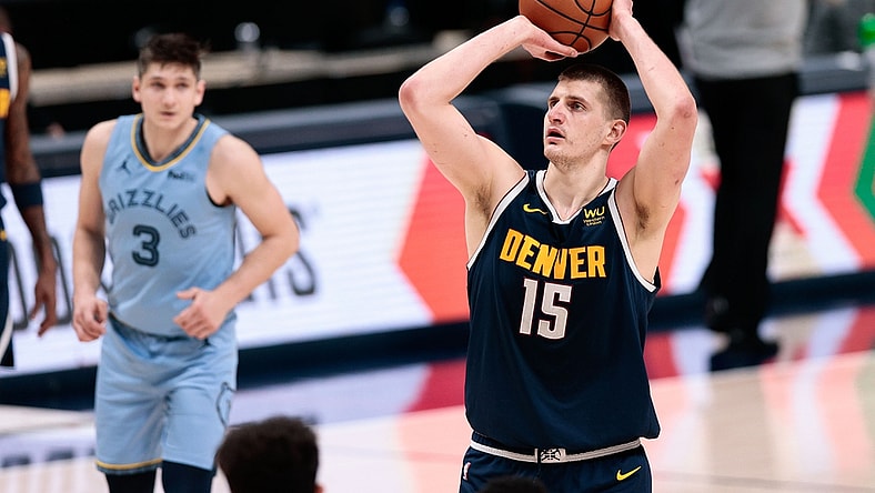 Apr 19, 2021; Denver, Colorado, USA; Denver Nuggets center Nikola Jokic (15) attempts a free throw in the fourth quarter against the Memphis Grizzlies at Ball Arena. Mandatory Credit: Isaiah J. Downing-USA TODAY Sports