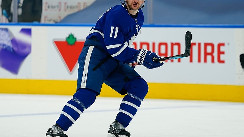 Apr 13, 2021; Toronto, Ontario, CAN; Toronto Maple Leafs forward Zach Hyman (11) skates against the Calgary Flames during the first period at Scotiabank Arena. Mandatory Credit: John E. Sokolowski-USA TODAY Sports