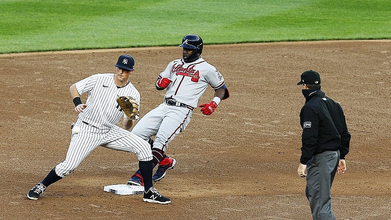 Apr 20, 2021; Bronx, New York, USA; Atlanta Braves center fielder Guillermo Heredia (38) goes into second base after hitting a double against the New York Yankees during the third inning at Yankee Stadium. Mandatory Credit: Andy Marlin-USA TODAY Sports