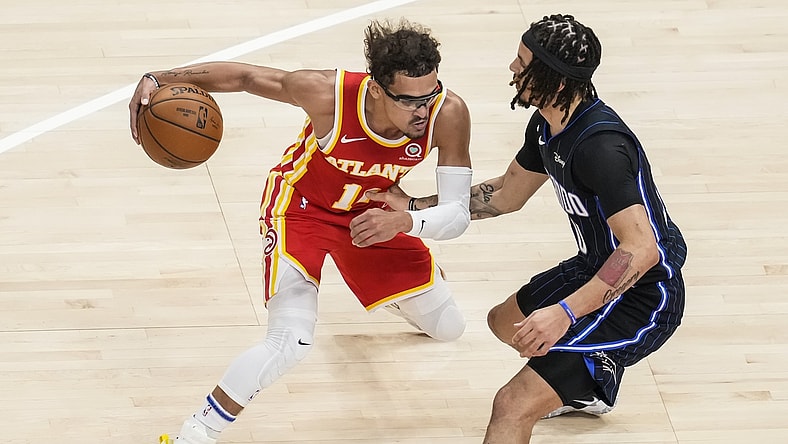 Apr 20, 2021; Atlanta, Georgia, USA; Atlanta Hawks guard Trae Young (11) dribbles against Orlando Magic guard Cole Anthony (50) during the first quarter at State Farm Arena. Mandatory Credit: Dale Zanine-USA TODAY Sports