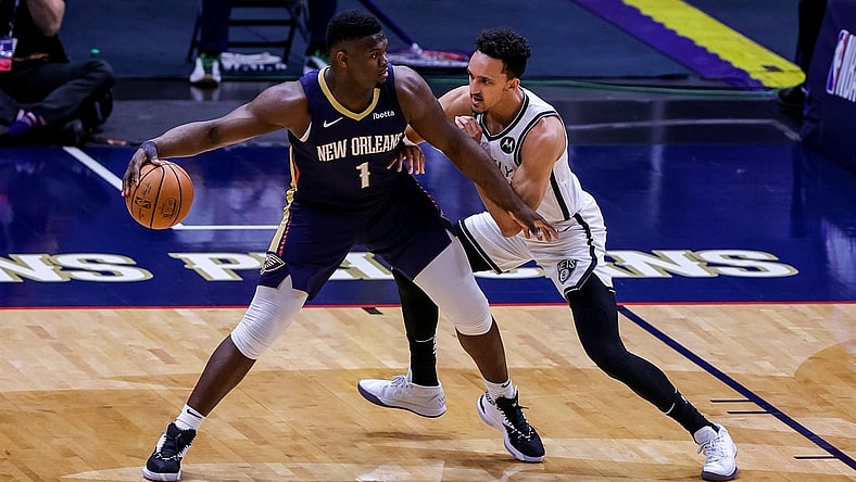 Apr 20, 2021; New Orleans, Louisiana, USA; New Orleans Pelicans forward Zion Williamson (1) looks to pass the ball against Brooklyn Nets guard Landry Shamet (20) during the first half at the Smoothie King Center. Mandatory Credit: Stephen Lew-USA TODAY Sports