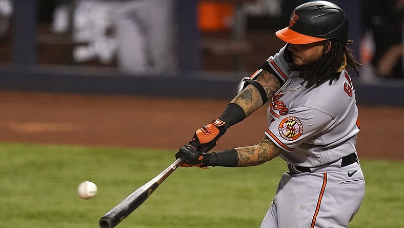 Apr 20, 2021; Miami, Florida, USA; Baltimore Orioles shortstop Freddy Galvis (2) connects for a solo homerun in the 3rd inning against the Miami Marlins at loanDepot park. Mandatory Credit: Jasen Vinlove-USA TODAY Sports