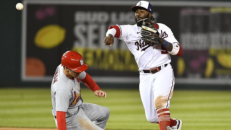 Apr 20, 2021; Washington, District of Columbia, USA; Washington Nationals second baseman Josh Harrison (5) forces out St. Louis Cardinals third baseman Tommy Edman (19) and throws to first to complete a double play during the sixth inning at Nationals Park. Mandatory Credit: Brad Mills-USA TODAY Sports