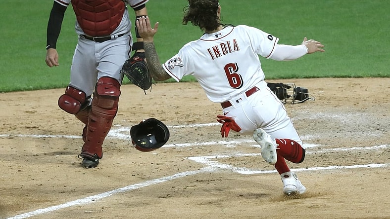 Apr 20, 2021; Cincinnati, Ohio, USA; Cincinnati Reds second baseman Jonathan India (6) scores against Arizona Diamondbacks catcher Carson Kelly (18) during the fourth inning at Great American Ball Park. Mandatory Credit: David Kohl-USA TODAY Sports