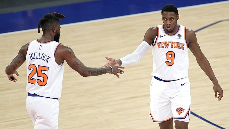 Apr 20, 2021; New York, New York, USA;  RJ Barrett #9 high-fives Reggie Bullock #25 of the New York Knicks during the second half against the Charlotte Hornets at Madison Square Garden. Mandatory Credit:  Sarah Stier/POOL PHOTOS-USA TODAY Sports