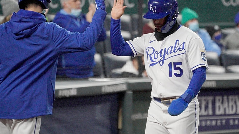 Apr 20, 2021; Kansas City, Missouri, USA; Kansas City Royals second base Whit Merrifield (15) is congratulated after scoring in the third inning against the Tampa Bay Rays at Kauffman Stadium. Mandatory Credit: Denny Medley-USA TODAY Sports