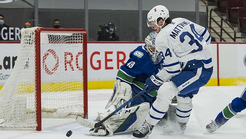 Apr 20, 2021; Vancouver, British Columbia, CAN;  Vancouver Canucks goalie Braden Holtby (49) makes a save on Toronto Maple Leafs forward Auston Matthews (34) in the first period at Rogers Arena. Mandatory Credit: Bob Frid-USA TODAY Sports