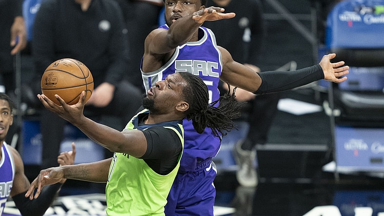 April 20, 2021; Sacramento, California, USA; Minnesota Timberwolves center Naz Reid (11) shoots the basketball against Sacramento Kings forward Chimezie Metu (25) during the second quarter at Golden 1 Center. Mandatory Credit: Kyle Terada-USA TODAY Sports
