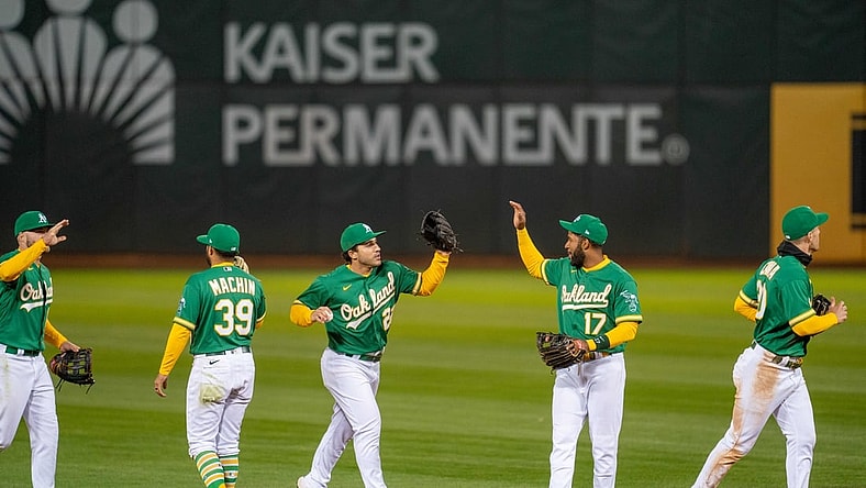 Apr 20, 2021; Oakland, California, USA; Oakland Athletics left fielder Mark Canha (20) and second baseman Vimael Machin (39) and shortstop Elvis Andrus (17) and center fielder Ramon Laureano (22) and Oakland Athletics right fielder Seth Brown (15) celebrate after the end of the game against the Minnesota Twins at RingCentral Coliseum. Mandatory Credit: Neville E. Guard-USA TODAY Sports
