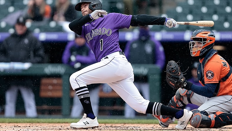 Apr 21, 2021; Denver, Colorado, USA; Colorado Rockies second baseman Garrett Hampson (1) hits a double in the second inning against the Houston Astros at Coors Field. Mandatory Credit: Isaiah J. Downing-USA TODAY Sports