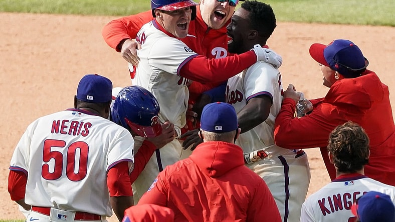 vApr 21, 2021; Philadelphia, Pennsylvania, USA; Philadelphia Phillies catcher Andrew Knapp (5) celebrates with teammates after hitting a walk off game winning RBI single during the ninth inning against the San Francisco Giants at Citizens Bank Park. Mandatory Credit: Bill Streicher-USA TODAY Sports