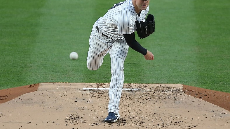 Apr 21, 2021; Bronx, New York, USA; New York Yankees starting pitcher Corey Kluber (28) throws against the Atlanta Braves during the second inning at Yankee Stadium. Mandatory Credit: Brad Penner-USA TODAY Sports