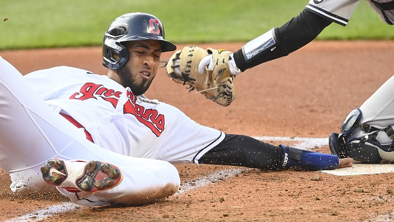 Apr 22, 2021; Cleveland, Ohio, USA; Cleveland Indians left fielder Eddie Rosario (9) scores in the first inning against the New York Yankees at Progressive Field. Mandatory Credit: David Richard-USA TODAY Sports