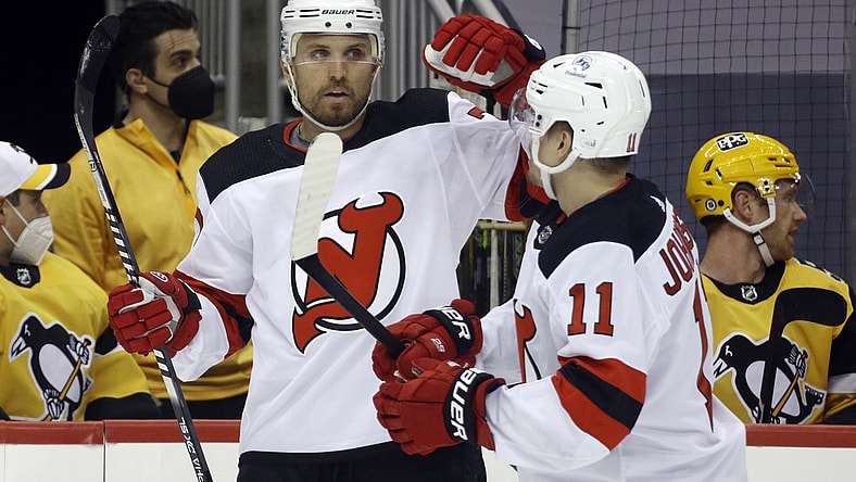Apr 22, 2021; Pittsburgh, Pennsylvania, USA;  New Jersey Devils defenseman Matt Tennyson (7) celebrates with left wing Andreas Johnsson (11) after scoring a goal against the Pittsburgh Penguins during the first period at PPG Paints Arena. Mandatory Credit: Charles LeClaire-USA TODAY Sports