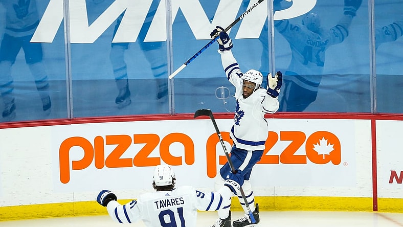 Apr 22, 2021; Winnipeg, Manitoba, CAN;  Toronto Maple Leafs forward Wayne Simmonds (24) celebrates his goal against the Winnipeg Jets during the first period at Bell MTS Place. Mandatory Credit: Terrence Lee-USA TODAY Sports