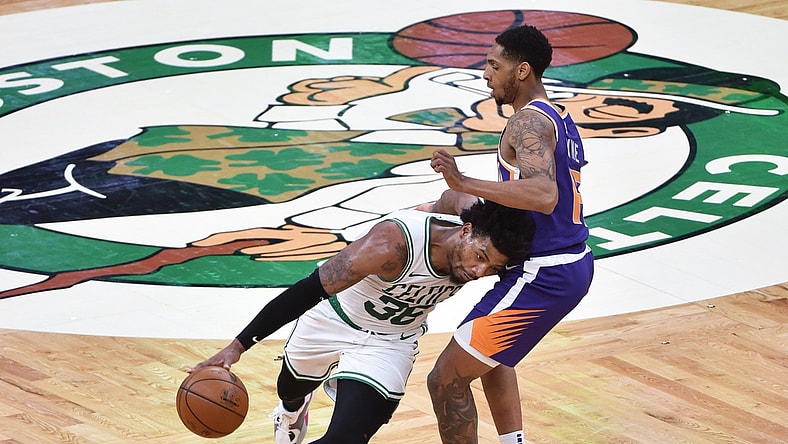 Apr 22, 2021; Boston, Massachusetts, USA;  Boston Celtics guard Marcus Smart (36) controls the ball while Phoenix Suns guard Cameron Payne (15) defends during the first half at TD Garden. Mandatory Credit: Bob DeChiara-USA TODAY Sports