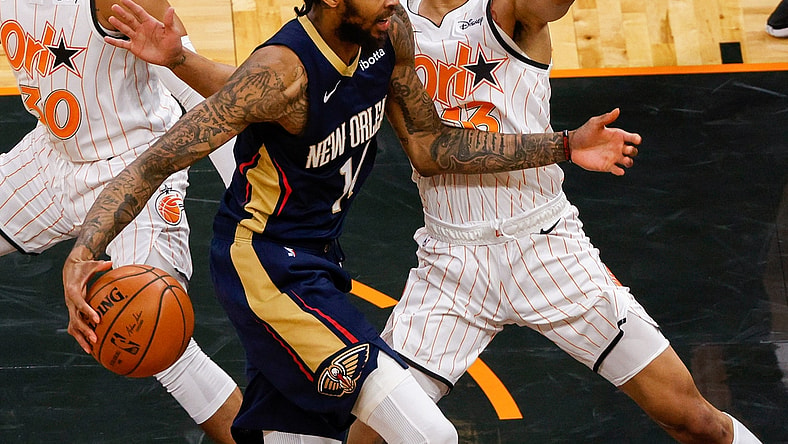 Apr 22, 2021; Orlando, Florida, USA; New Orleans Pelicans forward Brandon Ingram (14) drives the lane past Orlando Magic guard R.J. Hampton (13) in the second quarter at Amway Center. Mandatory Credit: Nathan Ray Seebeck-USA TODAY Sports