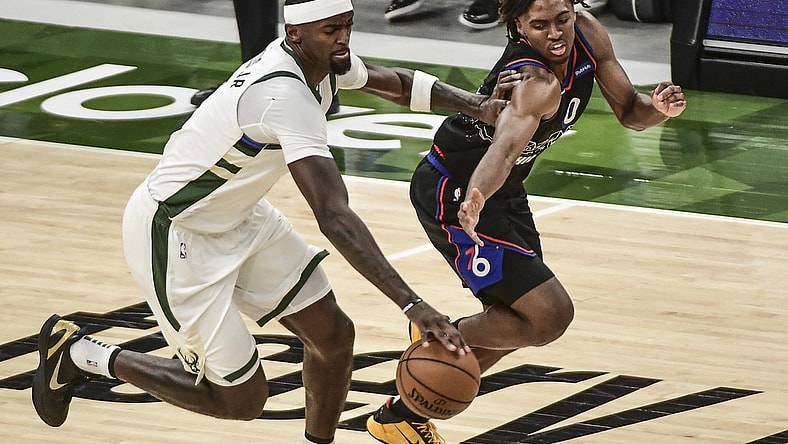 Apr 22, 2021; Milwaukee, Wisconsin, USA; Milwaukee Bucks center Bobby Portis (9) steals the ball from Philadelphia 76ers guard Tyrese Maxey (0) in the first quarter at Fiserv Forum. Mandatory Credit: Benny Sieu-USA TODAY Sports