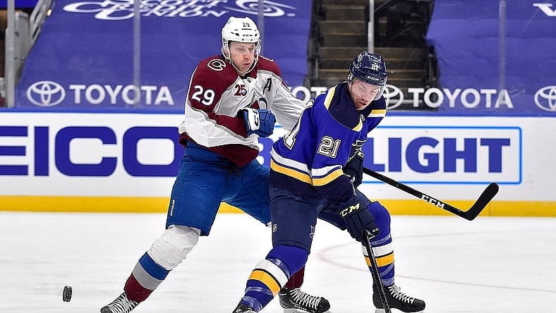 Apr 22, 2021; St. Louis, Missouri, USA;  Colorado Avalanche center Nathan MacKinnon (29) defends against St. Louis Blues center Tyler Bozak (21) during the first period at Enterprise Center. Mandatory Credit: Jeff Curry-USA TODAY Sports