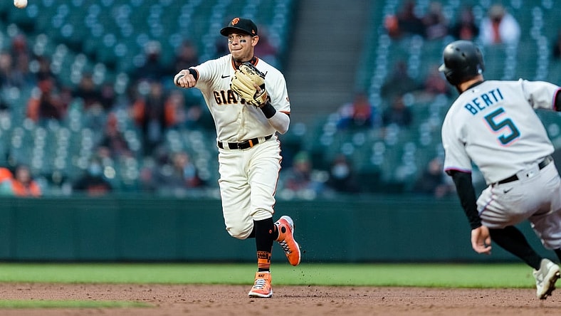 Apr 22, 2021; San Francisco, California, USA;  San Francisco Giants shortstop Mauricio Dubon (1) throws to first base for a double play against Miami Marlins in the second inning at Oracle Park. Mandatory Credit: John Hefti-USA TODAY Sports