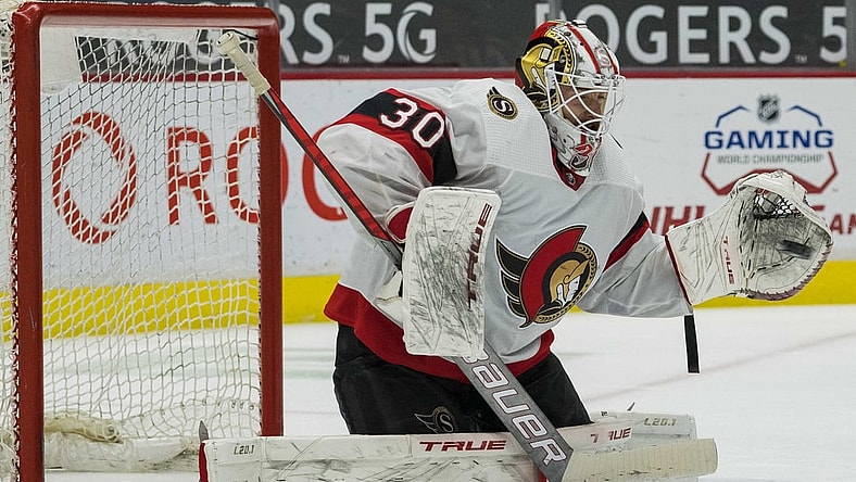 Apr 22, 2021; Vancouver, British Columbia, CAN; Ottawa Senators goalie Matt Murray (30) makes a save against the Vancouver Canucks  in the third period at Rogers Arena. Senators won 3-0.  Mandatory Credit: Bob Frid-USA TODAY Sports