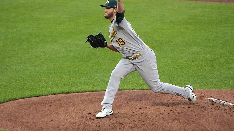 Apr 23, 2021; Baltimore, Maryland, USA; Oakland Athletics pitcher Cole Irvin (19) pitches against the Baltimore Orioles during the first inning at Oriole Park at Camden Yards. Mandatory Credit: Mitch Stringer-USA TODAY Sports