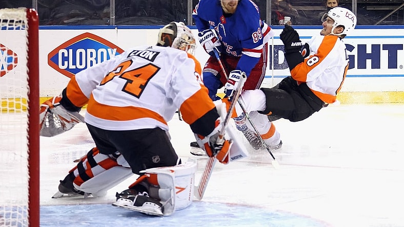 Apr 23, 2021; New York, New York, USA; Robert Hagg #8 of the Philadelphia Flyers bounces off Pavel Buchnevich #89 of the New York Rangers during the second period at Madison Square Garden. Mandatory Credit:  Bruce Bennett/POOL PHOTOS-USA TODAY Sports