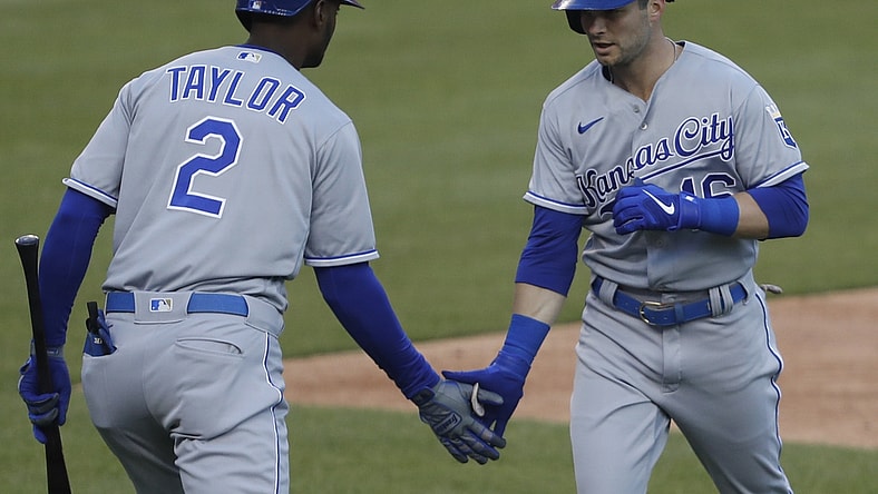 Apr 23, 2021; Detroit, Michigan, USA; Kansas City Royals left fielder Andrew Benintendi (16) celebrates with center fielder Michael A. Taylor (2) after hitting a solo home run during the second inning at Comerica Park. Mandatory Credit: Raj Mehta-USA TODAY Sports