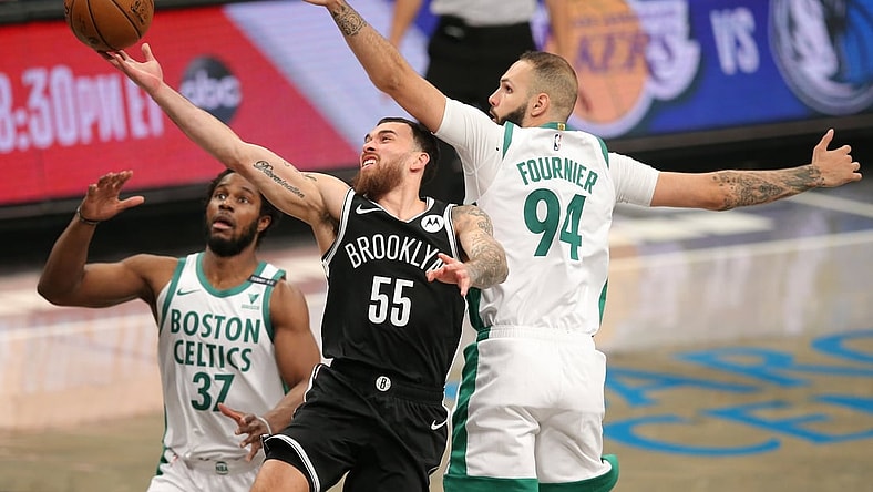 Apr 23, 2021; Brooklyn, New York, USA; Brooklyn Nets forward Mike James (55) drives to the basket against Boston Celtics power forward Semi Ojeleye (37) and shooting guard Evan Fournier (94) during the third quarter at Barclays Center. Mandatory Credit: Brad Penner-USA TODAY Sports