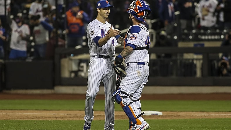 Apr 23, 2021; New York City, New York, USA; New York Mets pitcher Jacob deGrom (left) and catcher Tomas Nido (right) celebrate after defeating the Washington Nationals 6-0  at Citi Field. Mandatory Credit: Wendell Cruz-USA TODAY Sports