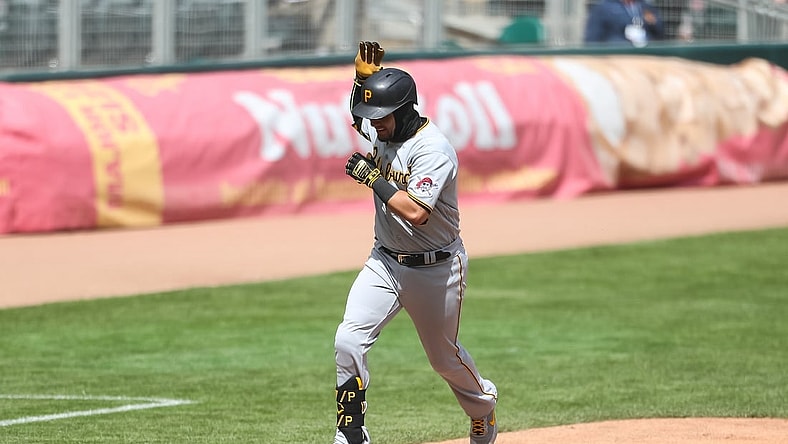 Apr 24, 2021; Minneapolis, Minnesota, USA; Pittsburgh Pirates catcher Michael Perez (5) celebrates as he rounds the bases after hitting a solo home run against the Minnesota Twins in the fifth inning at Target Field. Mandatory Credit: David Berding-USA TODAY Sports