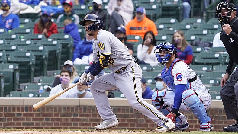 Apr 24, 2021; Chicago, Illinois, USA; Milwaukee Brewers first baseman Keston Hiura (18) hits a double against the Chicago Cubs during the fifth inning at Wrigley Field. Mandatory Credit: David Banks-USA TODAY Sports