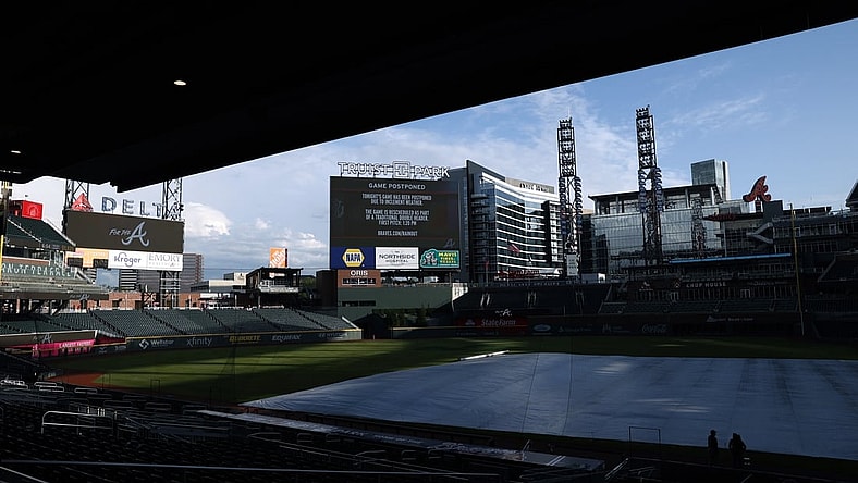 Apr 24, 2021; Atlanta, Georgia, USA; The scoreboard announces that the game between the Arizona Diamondbacks and the Atlanta Braves is postponed at Truist Park. The postponed game is rescheduled as part of a traditional double header, tomorrow, Sunday April 25, 2021. Mandatory Credit: Jason Getz-USA TODAY Sports