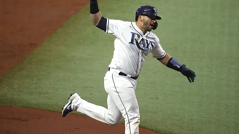 Apr 24, 2021; St. Petersburg, Florida, USA;Tampa Bay Rays catcher Mike Zunino (10) celebrates as he hits a home run during the second inning against the Toronto Blue Jays  at Tropicana Field. Mandatory Credit: Kim Klement-USA TODAY Sports