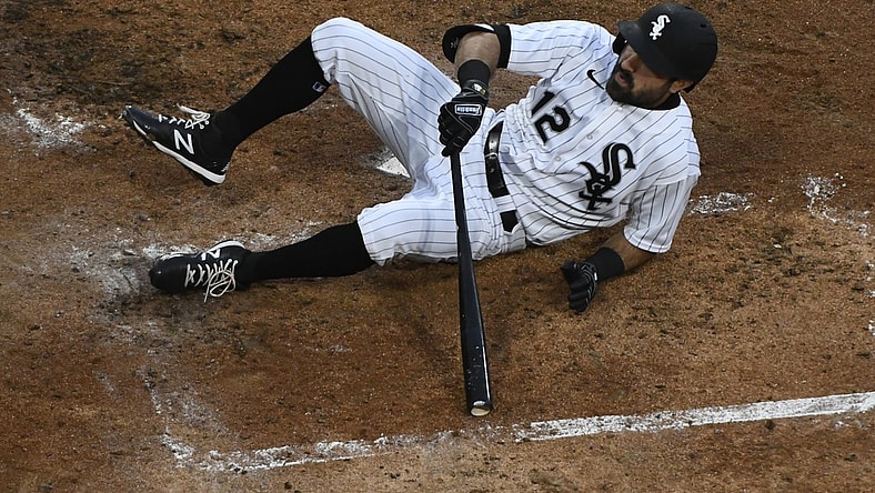 Apr 24, 2021; Chicago, Illinois, USA;  Chicago White Sox right fielder Adam Eaton (12) is nearly hit by a pitch thrown by Texas Rangers starting pitcher Kyle Gibson (44) in thethird t inning at Guaranteed Rate Field. Mandatory Credit: Matt Marton-USA TODAY Sports