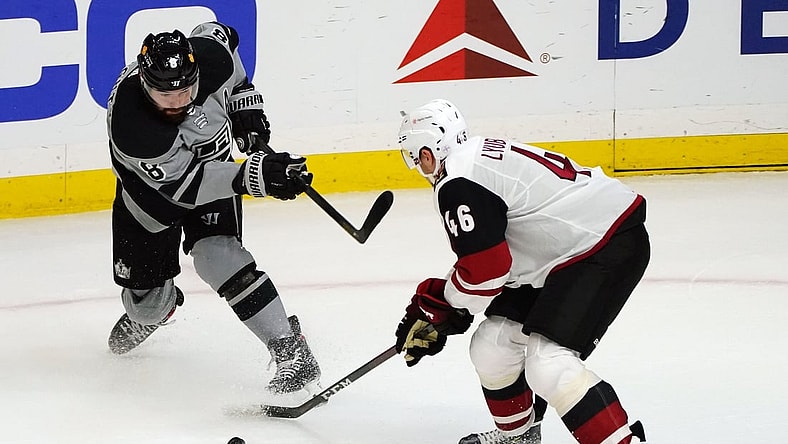 Apr 24, 2021; Los Angeles, California, USA; Arizona Coyotes defenseman Ilya Lyubushkin (46) blocks a shot against Los Angeles Kings defenseman Drew Doughty (8) during the second period at Staples Center. Mandatory Credit: Gary A. Vasquez-USA TODAY Sports