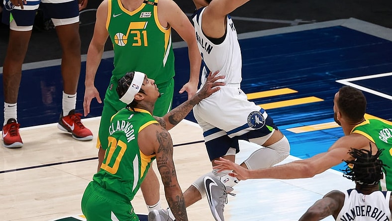 Apr 24, 2021; Salt Lake City, Utah, USA; Minnesota Timberwolves guard Jordan McLaughlin (6) gets past Utah Jazz guard Jordan Clarkson (00) and to the basket during the fourth quarter at Vivint Arena. Minnesota Timberwolves won 101-96. Mandatory Credit: Chris Nicoll-USA TODAY Sports