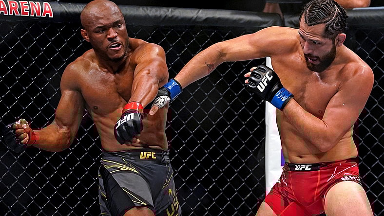 Apr 24, 2021; Jacksonville, Florida, USA; Kamaru Usman (Red Gloves) fights Jorge Masvidal (Blue Gloves) during UFC 261 at VyStar Veterans Memorial Arena. Mandatory Credit: Jasen Vinlove-USA TODAY Sports