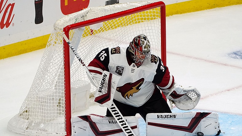 Apr 24, 2021; Los Angeles, California, USA; Arizona Coyotes goaltender Darcy Kuemper (35) blocks a shot against the Los Angeles Kings during the third period at Staples Center. Mandatory Credit: Gary A. Vasquez-USA TODAY Sports